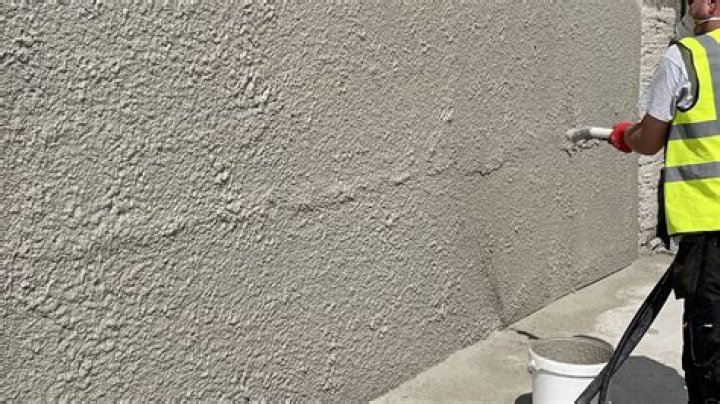 Do you put Waterproofer in top coat of render?