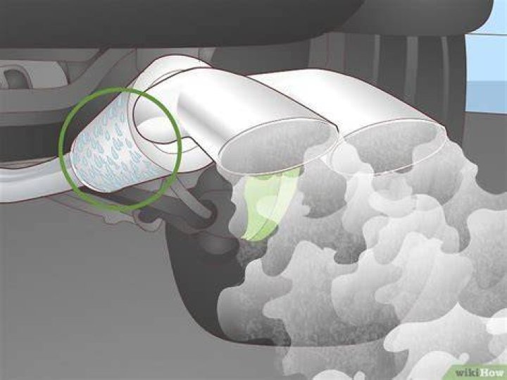 What causes a puff of white smoke from exhaust?